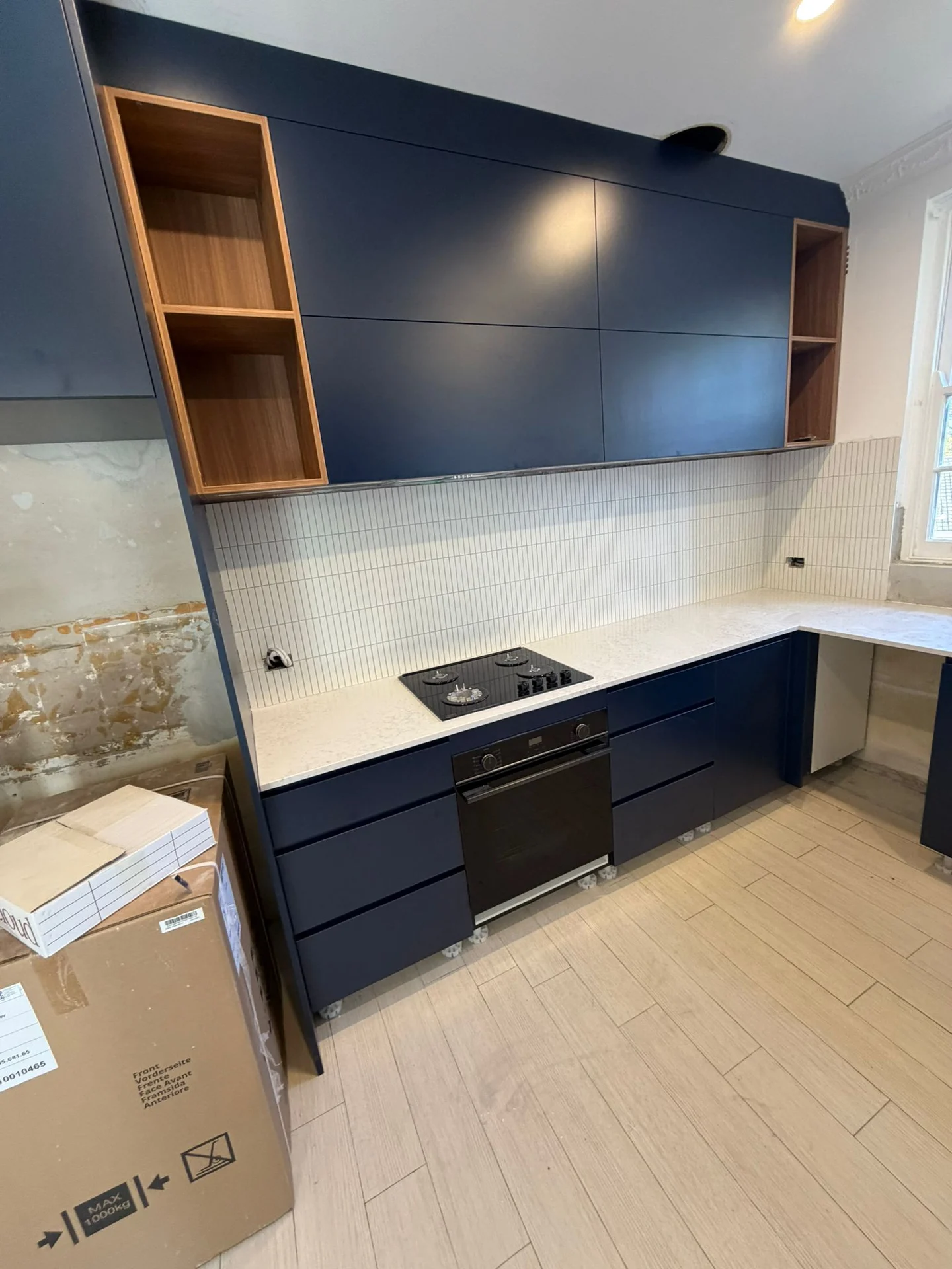 White tiled splashback around a kitchen corner