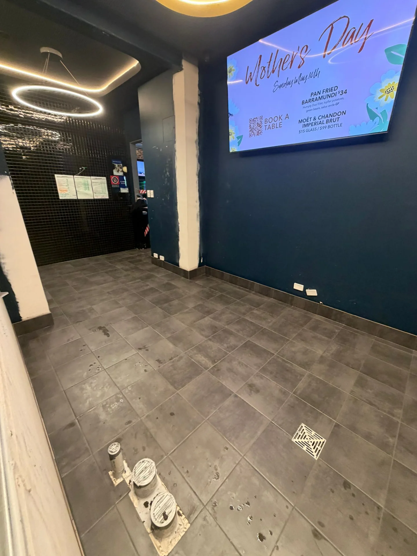 Dark floor tiles in a commercial interior